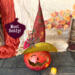 A fall pumpkin gourd wearing a handmade witch hat. This pumpkin is named Heddy. 